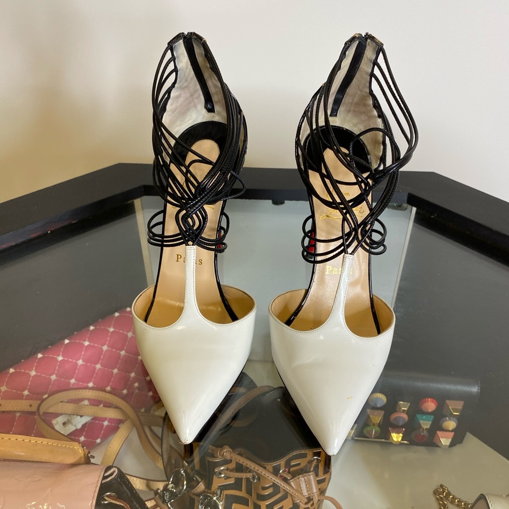 Louboutin white pointed heels w leopard back